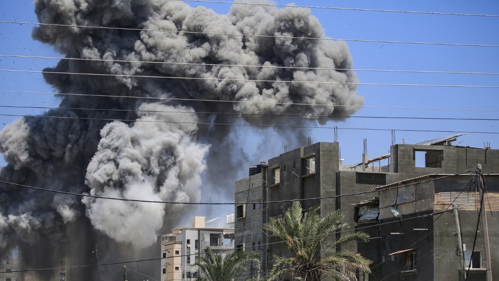 Smoke rises after an Israeli strike in Nuseirat, Gaza, on 20 July 2024 (Eyad Baba/AFP)