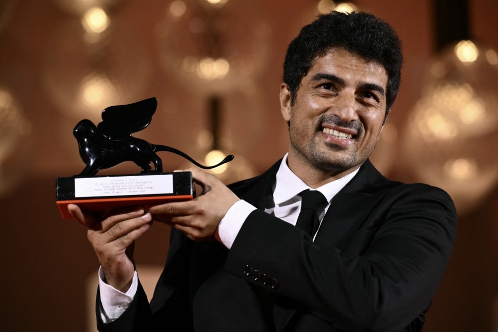 Murat Fıratoglu poses with the Orizzonti Award Special Jury Prize he received for Hemme'nin Oldugu Gunlerden Biri (One of Those days when Hemme dies) during a photocall following the award ceremony of the 81st Venice Film Festival on September 7, 2024 at Venice Lido. (Marco Bertorello/ AFP)