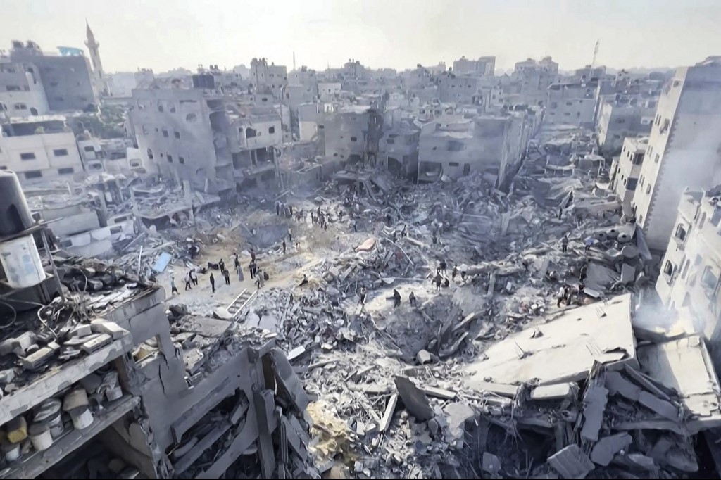 Jabalia refugee camp in Gaza after Israeli air strikes in which experts say precision-guided missiles used (AFP)
