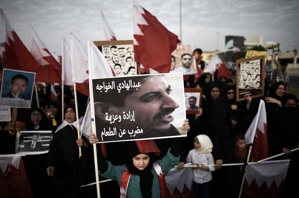 A placard reads "Abdulhadi al-Khawaja, will and determination, hunger strike" during an anti-government protest on 5 September 2014 (AFP/File photo)