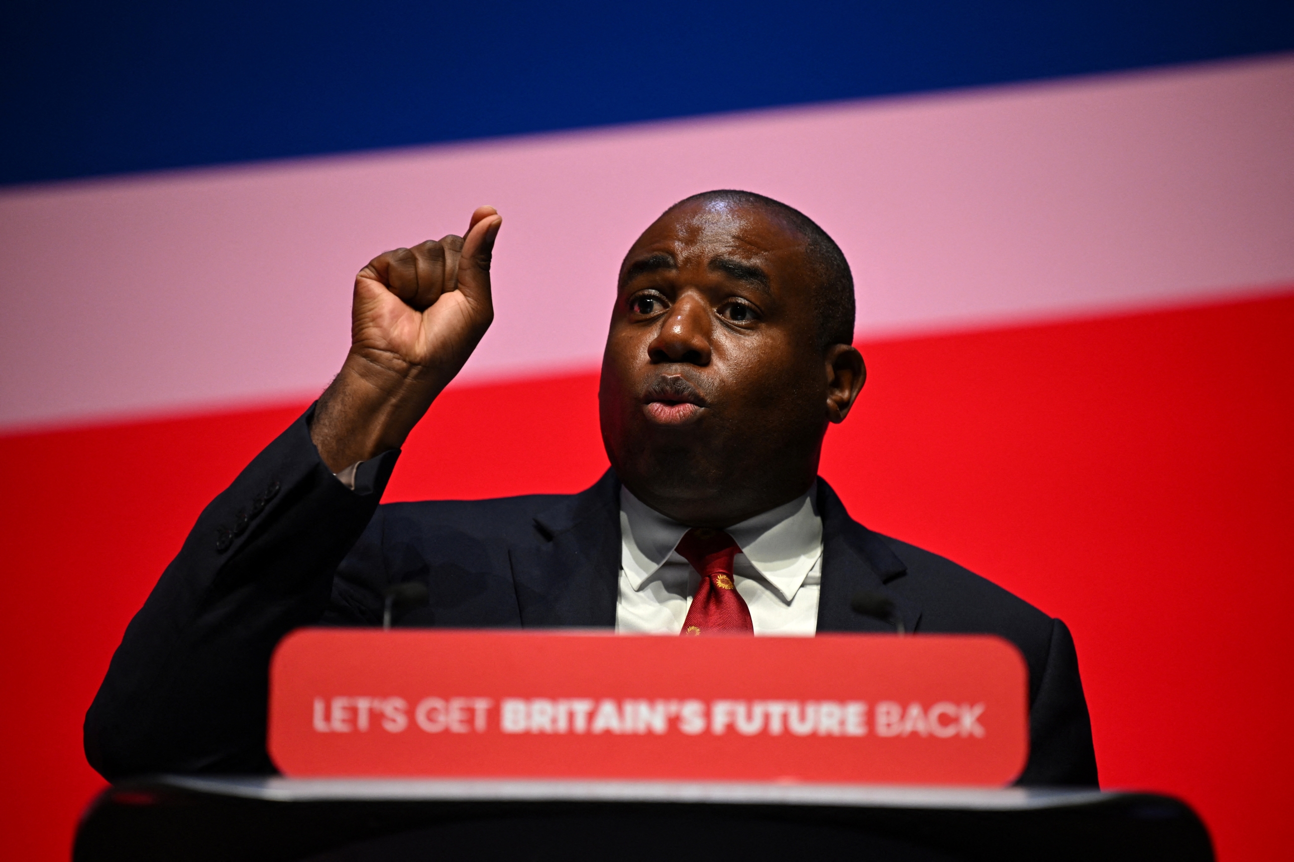 David Lammy addresses delegates on the second day of the annual Labour Party conference in Liverpool, on 9 October, 2023 (AFP)