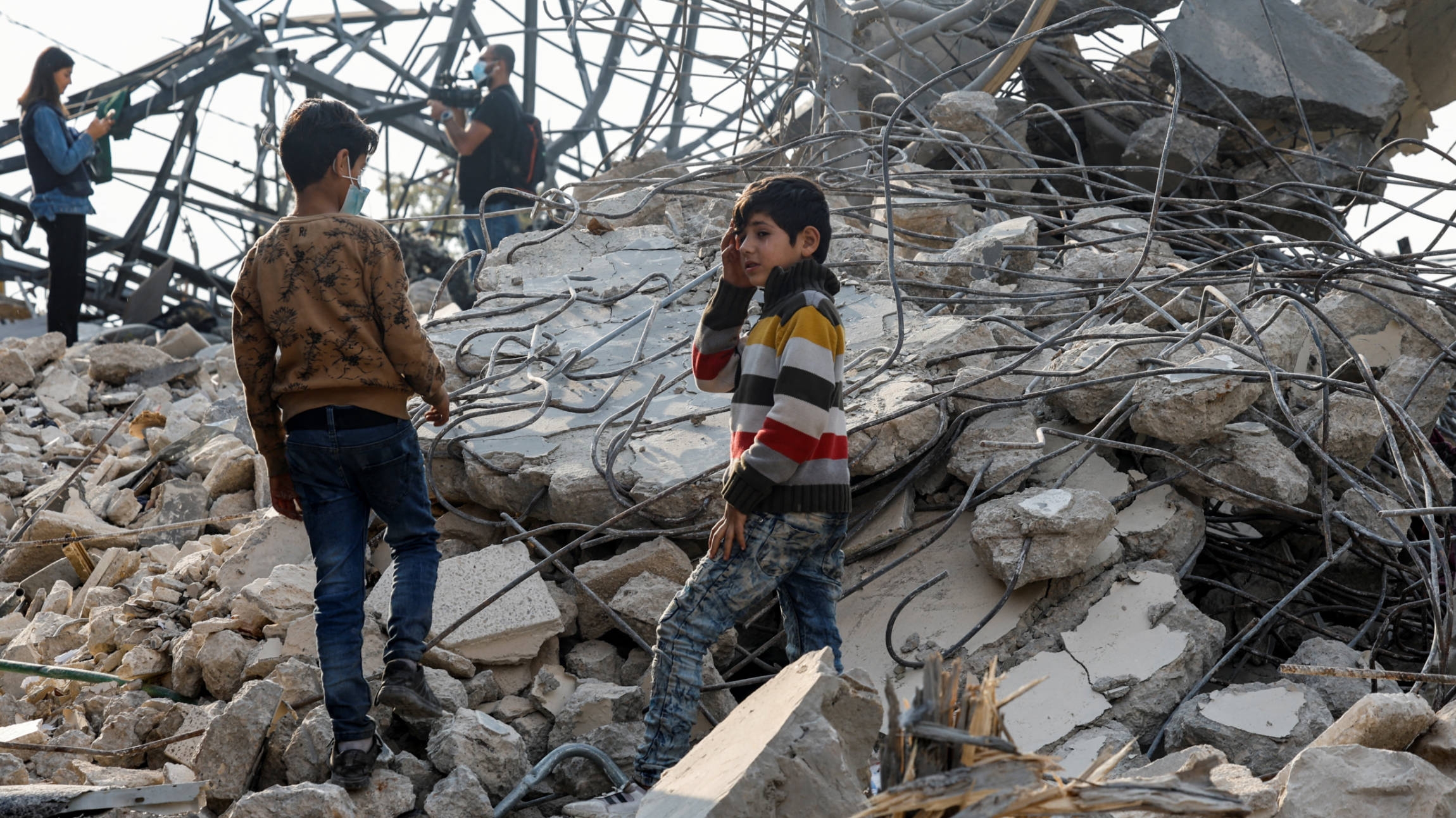 People inspect a site of an Israeli strike in the town of Almat in Jbeil district, Lebanon, 10 November 2024 (Reuters)