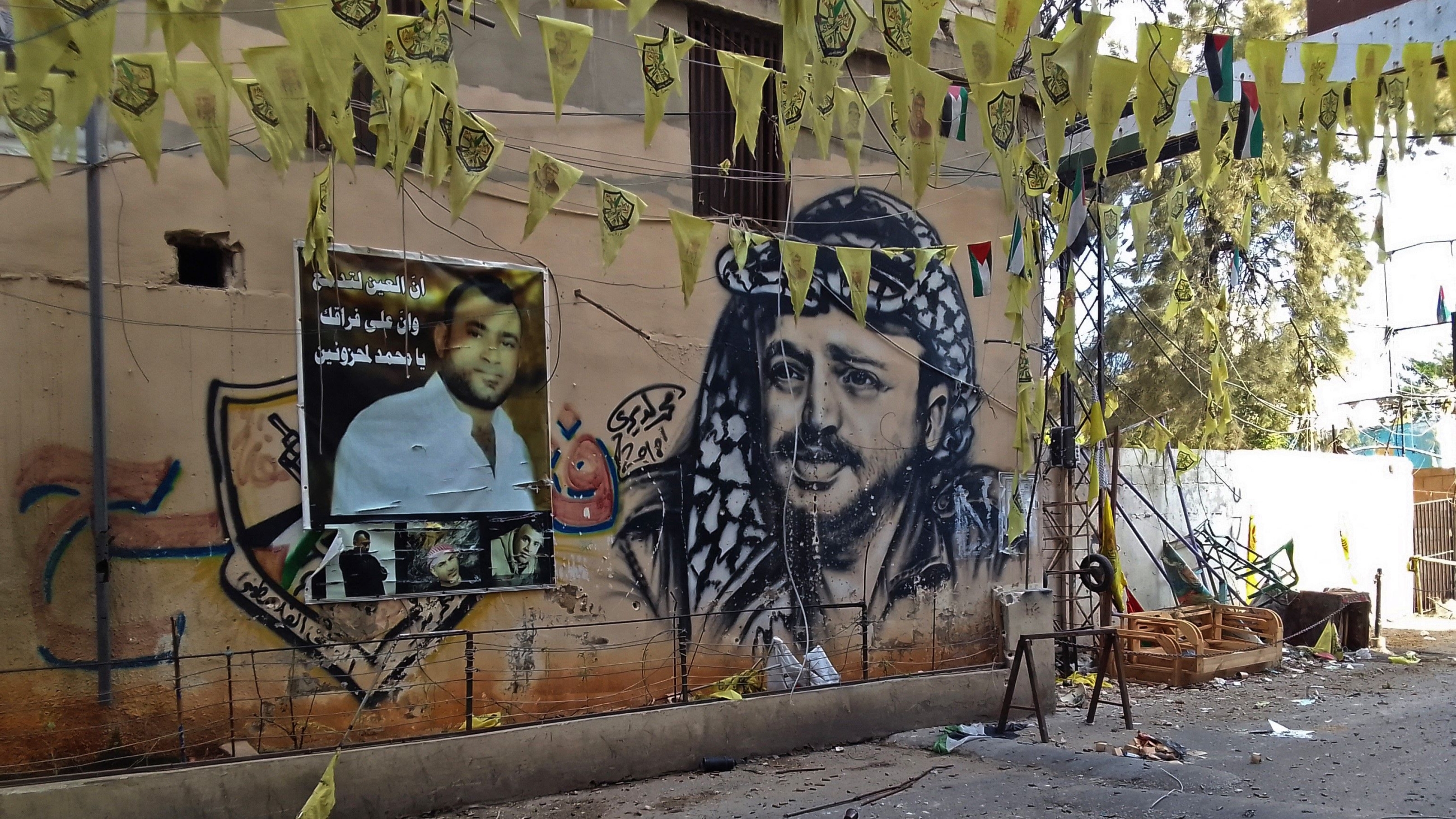 A mural in Ain al-Hilweh depicts the late Fatah leader and Palestinian president, Yasser Arafat (AFP)