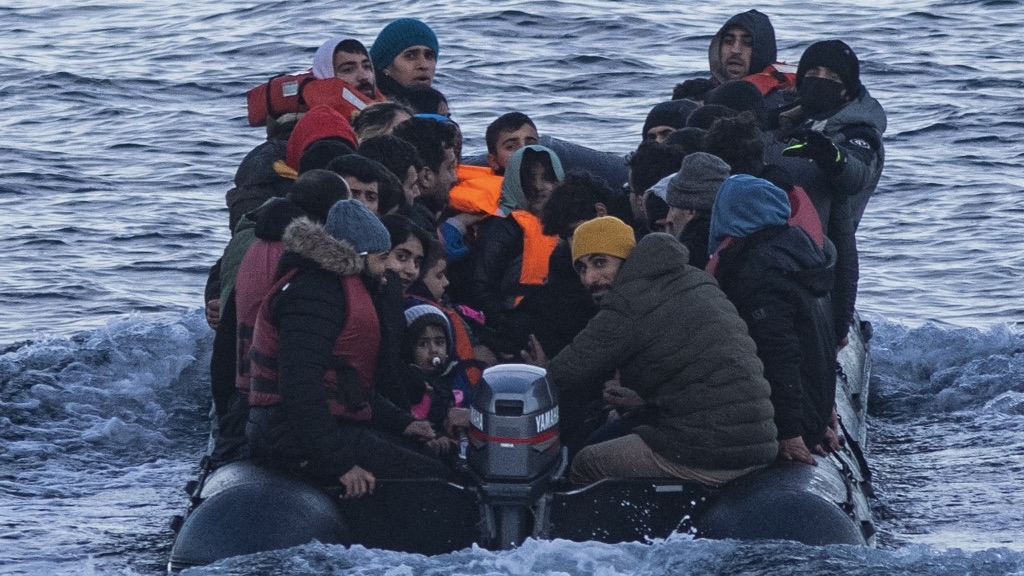 Migrants cross the English Channel in a dinghy from France to Britain on 15 March 2022 (Sameer al-Doumy/AFP)