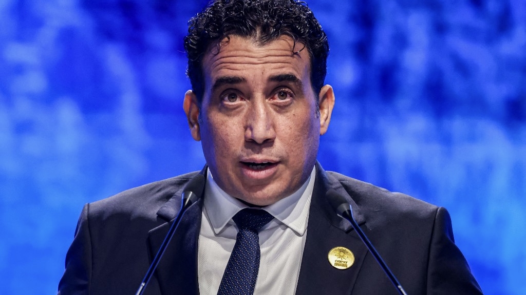 Mohamed Menfi, leader of the Tripoli-based Libyan Presidential Council, delivers a speech at Cop27 in Sharm el-Sheikh, Egypt, 8 November 2022 (Ahmad Gharabli/AFP)