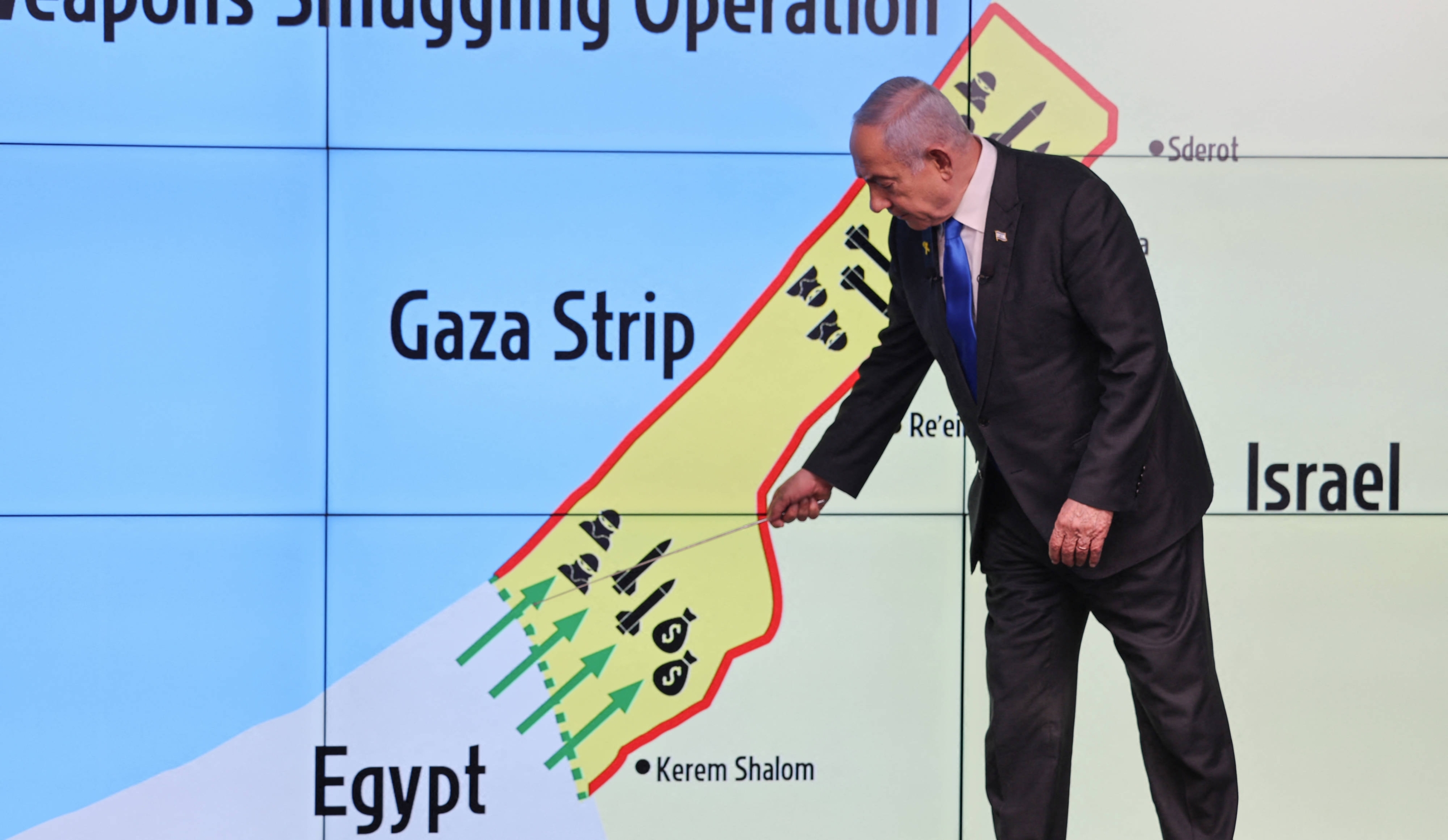 Israel's Prime Minister Benjamin Netanyahu points at the Philadelphi corridor on a map during a press conference at the Government Press Office (GPO) in Jerusalem on 4 September 2024 (AFP)