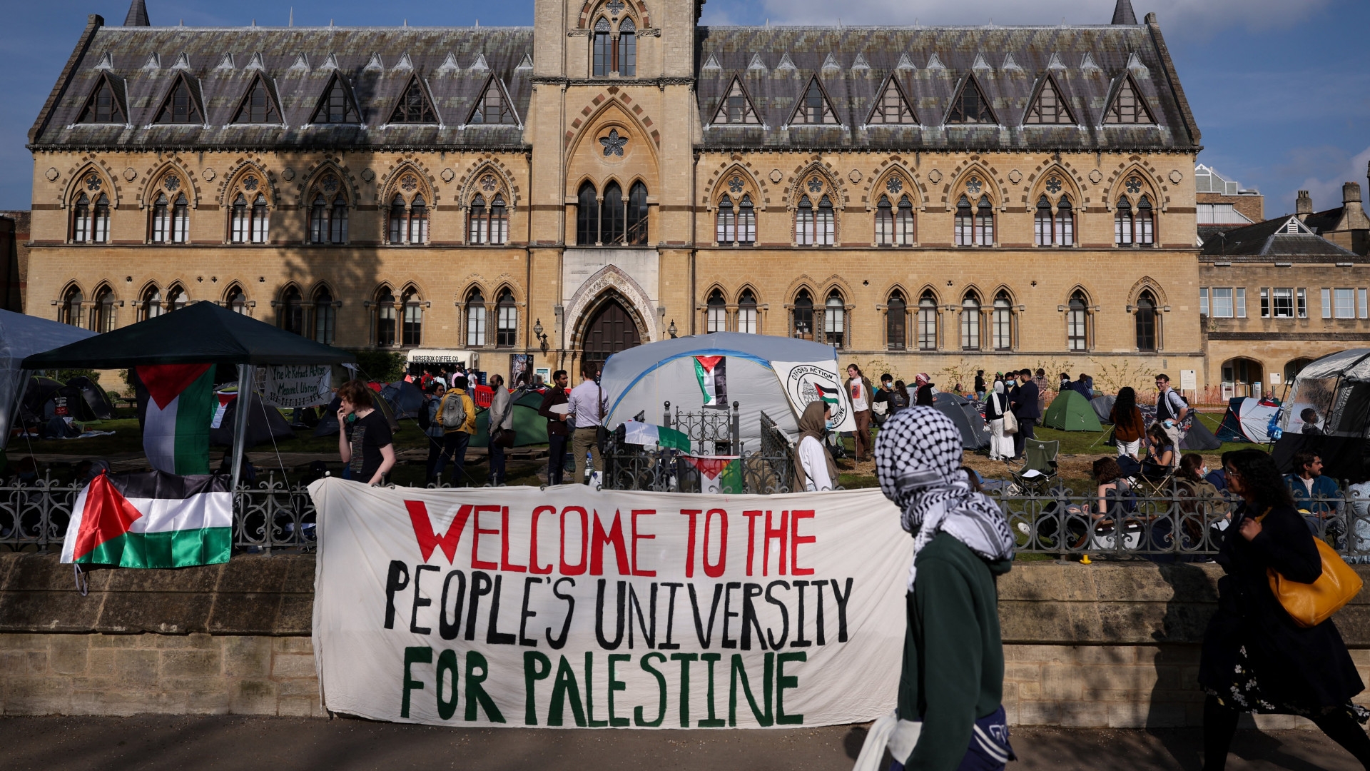 Students calling for divestment from Israel over its genocide in Gaza set up an encampment at Oxford University, UK, on 7 May 2024 (Adrian Dennis/AFP)