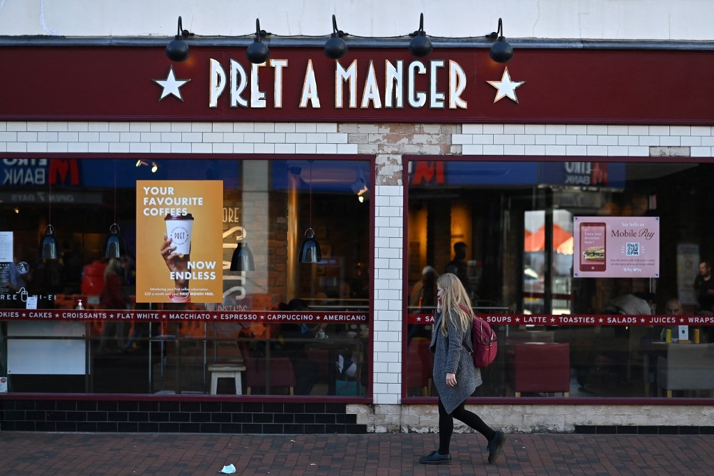 A woman walks past a Pret A Manger shop in Royal Tunbridge Wells, southwest England, on 29 September 2020 (Ben Stansall/AFP)