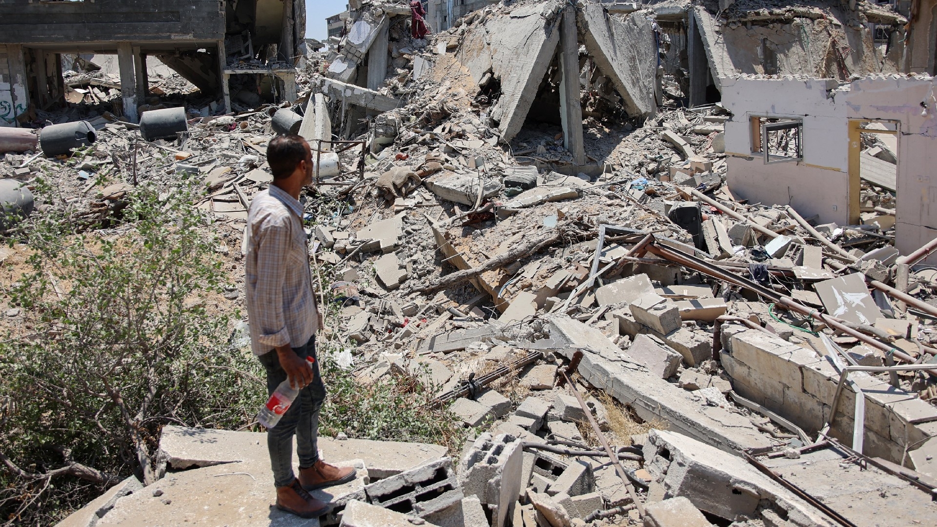 Palestinians inspect the destruction in the Tal Al-Hawa neighbourhood in southern Gaza City on 5 June 2024 (AFP)