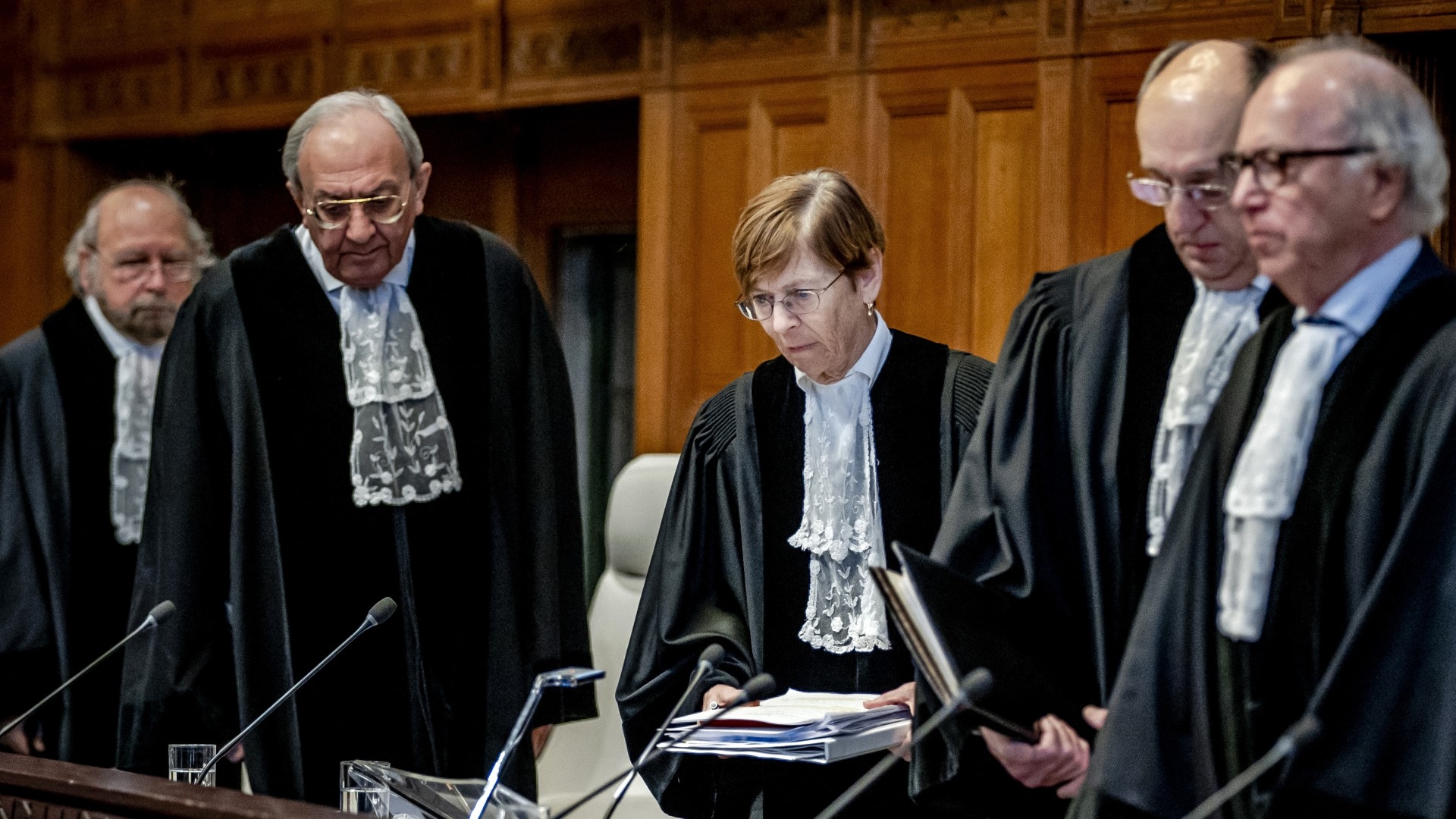 President Joan Donoghue (C), and other judges in the International Court of Justice (ICJ) take their seats prior to the hearing on the genocide case against Israel, brought by South Africa, in The Hague on 11 January, 2024 (AFP)