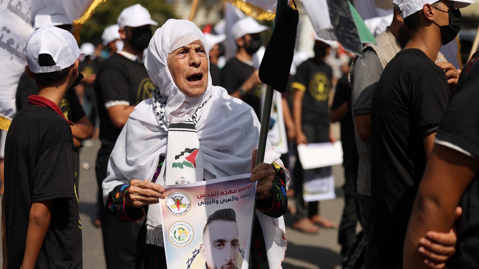 Protesters rally in solidarity with Palestinian prisoners in Israeli jails, outside the International Committee of the Red Cross (ICRC) office in Gaza City on 21 August, 2023 (AFP)