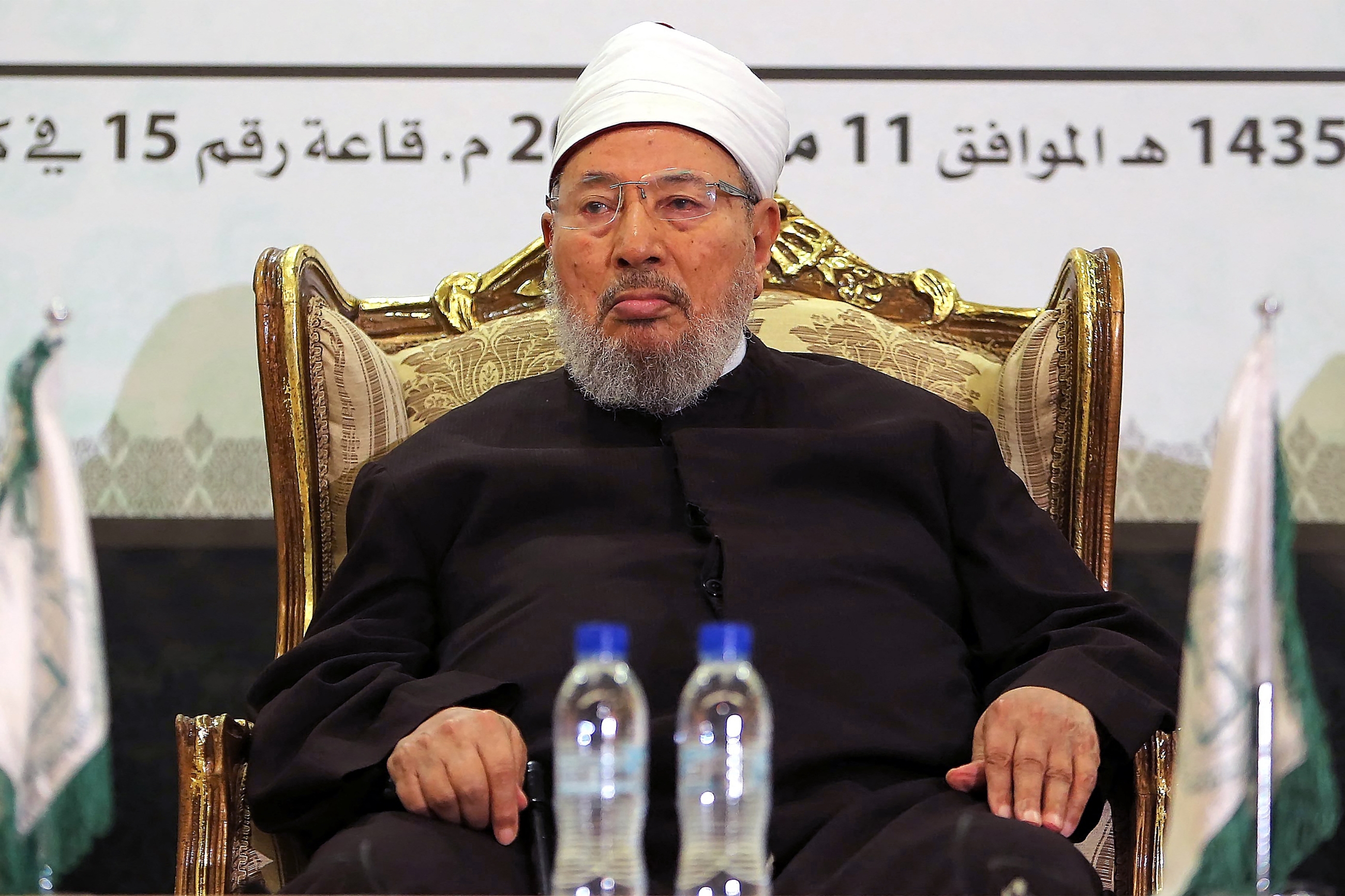 In this file photo, late Egyptian cleric and chairman of the International Union of Muslim Scholars Sheikh Yusuf al-Qaradawi attends a seminar in Doha, Qatar on 11 May 2014 (AFP)