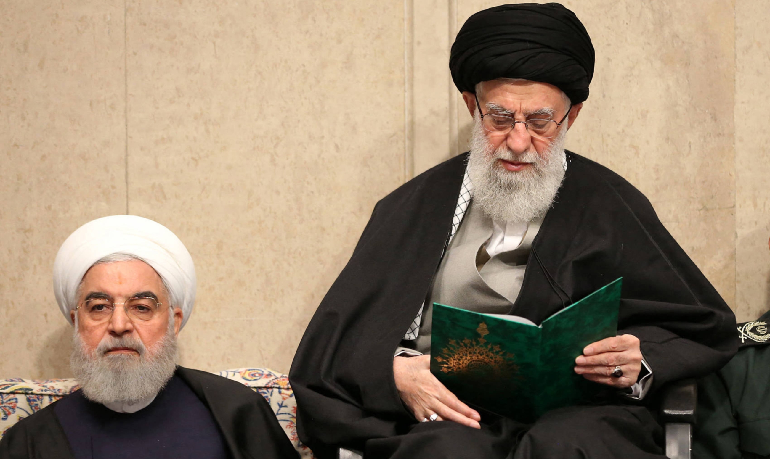 Iran's Supreme Leader Ayatollah Ali Khamenei (R) and then president Hassan Rouhani pictured during a mourning ceremony in Tehran for slain top general Qasem Soleimani, 9 January 2020 (AFP)
