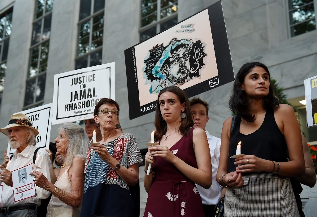 Protesters gather in front of the Saudi embassy in Washington to remember slain Middle East Eye columnist Jamal Khashoggi