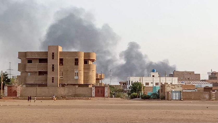 Smoke billows in the distance around the Khartoum Bahri district in Sudan amid ongoing fighting on 14 July 2023 (AFP)
