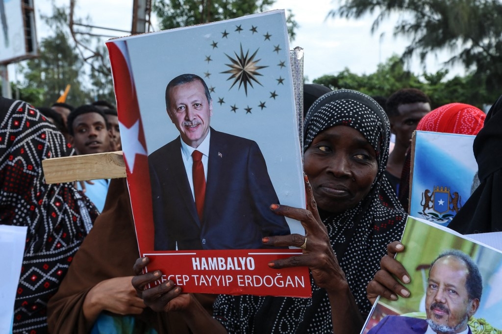 Somalis celebrate the victory of Turkish President Recep Tayyip Erdogan after he won the run-off presidential election during the celebrations organised by the government in Mogadishu on 29 May 2023 (Hassan Ali Elmi/AFP)