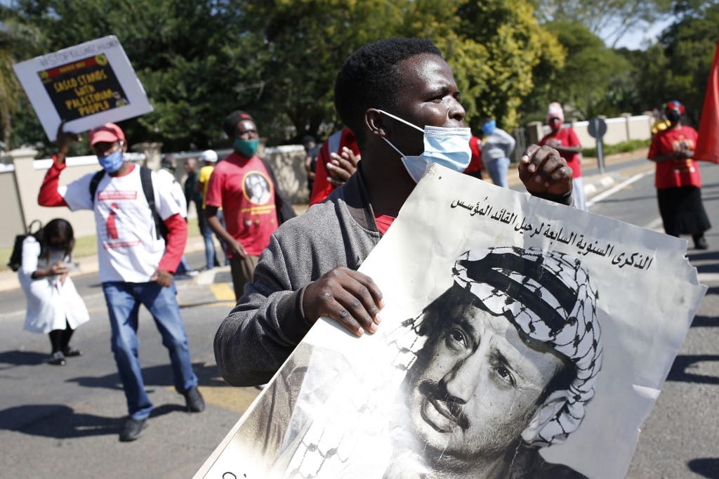 A South African Student Congress (SASCO) member protests outside Israel's embassy in Pretoria 