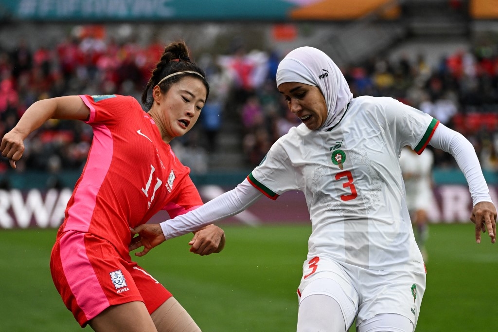 Morocco's Nouhaila Benzina (R), made history when she became the first player to wear a hijab at a World Cup in her side's victory against South Korea Stadium in Adelaide on 30 July 2023 (AFP)
