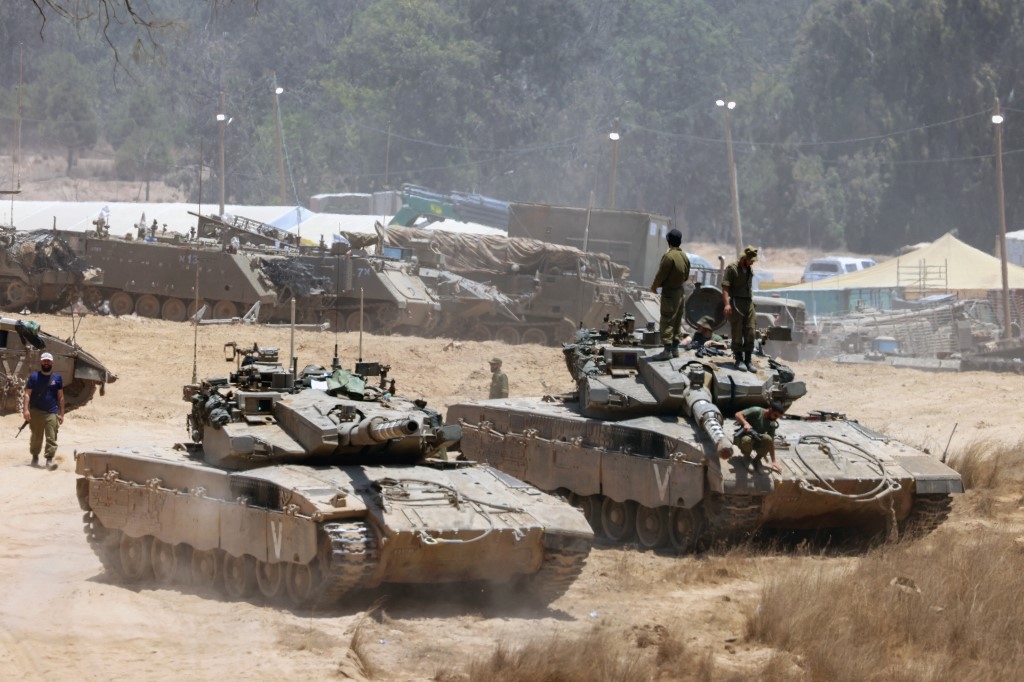 Israeli army tanks deploy in an area of Israel's southern boundary with the Gaza Strip on 5 June (Jack Guez/AFP)