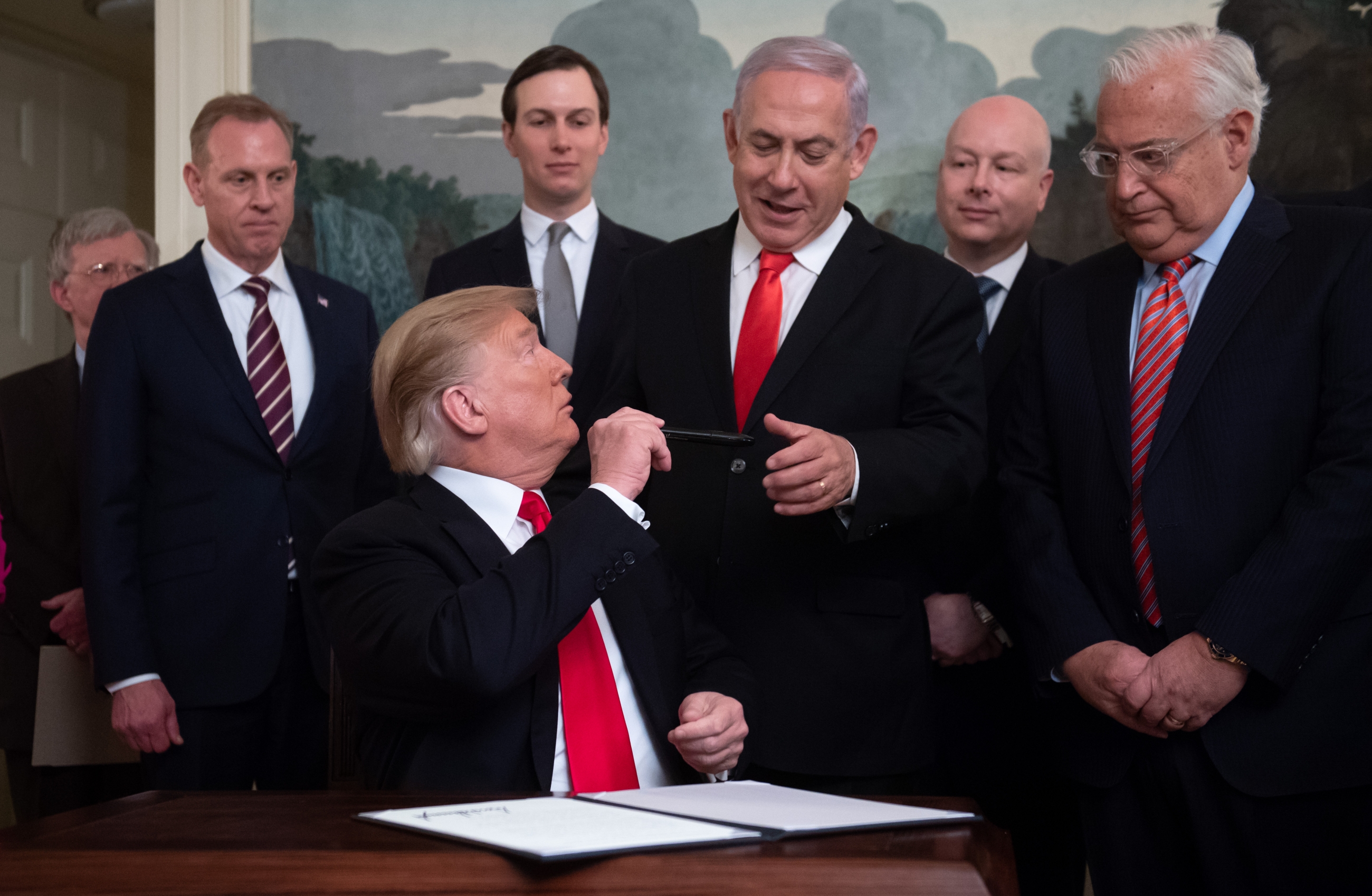 This image of Donald Trump handing Benjamin Netanyahu a pen was used in J Street's promotion