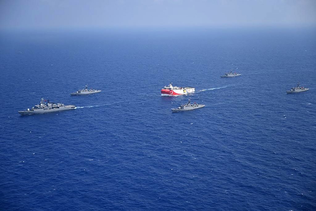 Turkish seismic research vessel 'Oruc Reis' (C) as it is escorted by Turkish Naval ships in the Mediterranean Sea, off Antalya on August 10, 2020.  (Handout / Turkish Defense Ministry)