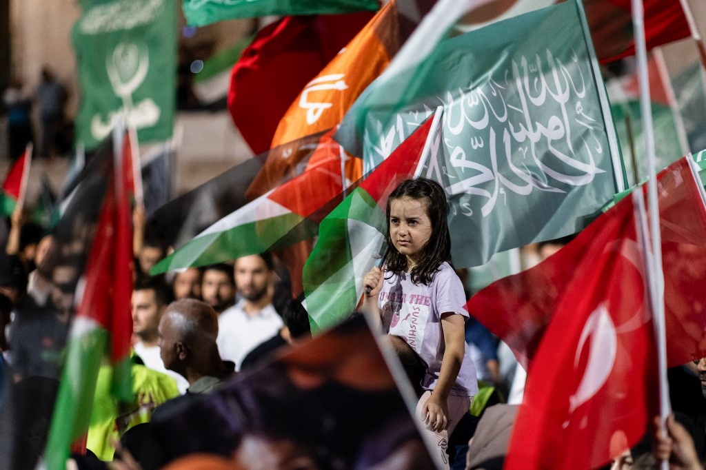 Pro-Palestinian demonstrators wave Palestinian flags as they take part in a rally to protest the death of the Hamas leader Ismail Haniyeh, following evening prayers in Fatih district of Istanbul on July 31, 2024. (Kemal Aslan / AFP)