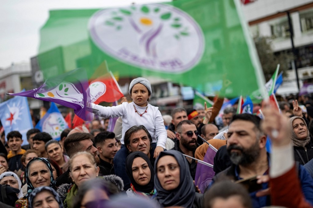 Supporters of the pro-Kurdish Peoples DEM Party attend a rally for the Turkish Municipal elections to be held on March 31, in Esenyurt Square, in Istanbul on February 25, 2024.(Yasin Akgul/AFP)