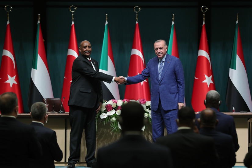 Turkish President Recep Tayyip Erdogan shakes hands with Sudan's Chairman of the Transitional Sovereignty Council General Abdel Fattah al-Burhan in Ankara, Turkey on 12 August 2021 (Turkish Presidency)
