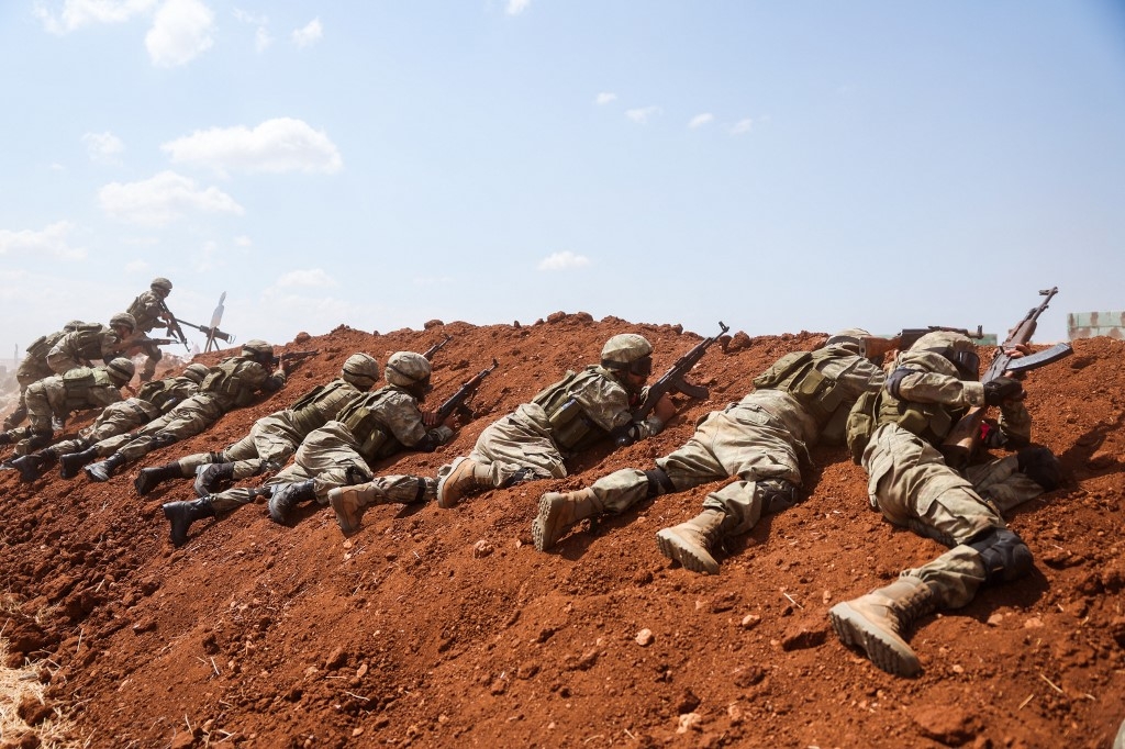 Turkey-backed Syrian fighters take part in a military drill near Marea in the rebel-controlled northern part of Syria's Aleppo province on 29 August 2023 (AFP)
