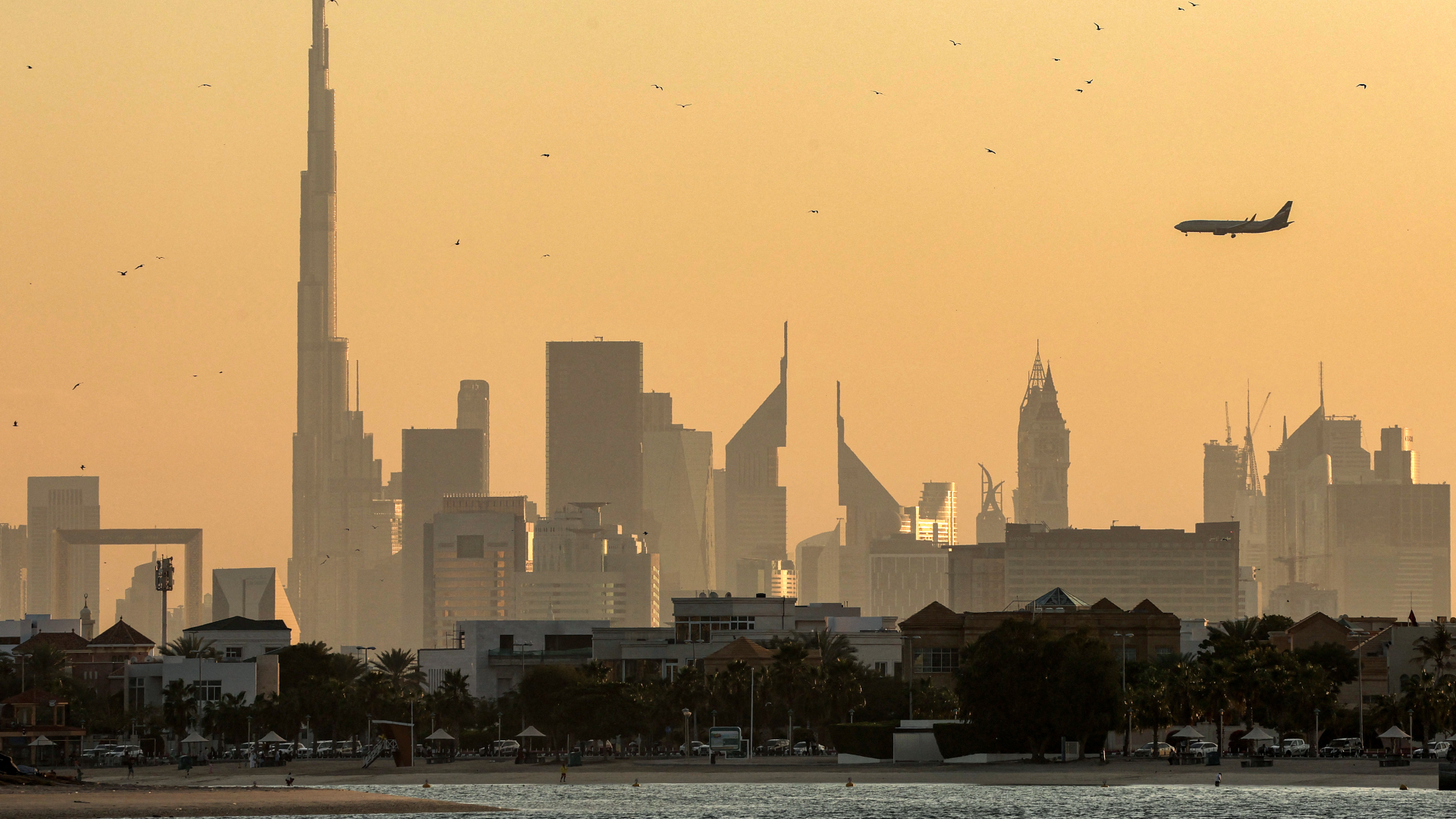 A photo of Dubai skyline with Burj Khalifa and an airplane in February 2024. AFP/Giuseppe Cacace.