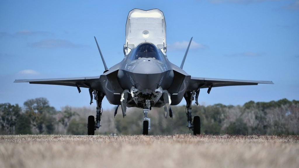 F-35B Lightning II aircraft fly during a training session in 2016 as UK military personnel watch (AFP)