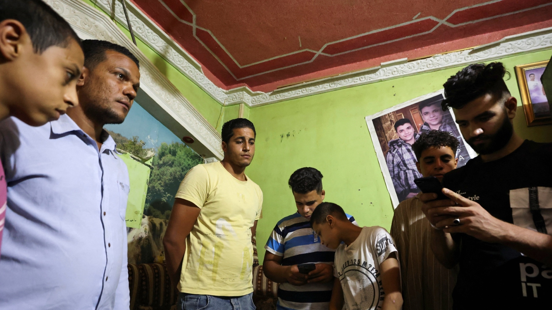 Relatives of an Egyptian who was involved in the shipwreck off Greece, at al-Batanum village in Egypt, 16 June (Reuters)