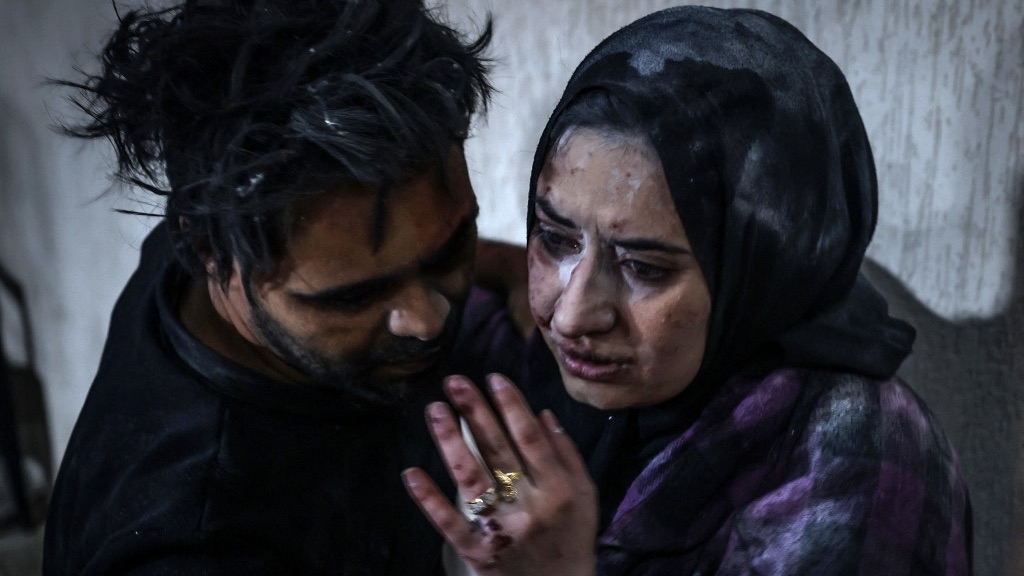 Victims of an Israeli army strike outside Kuwait hospital, in Rafah in the southern Gaza Strip, are pictured on 28 December 2023 (Mohammed Abed/AFP)