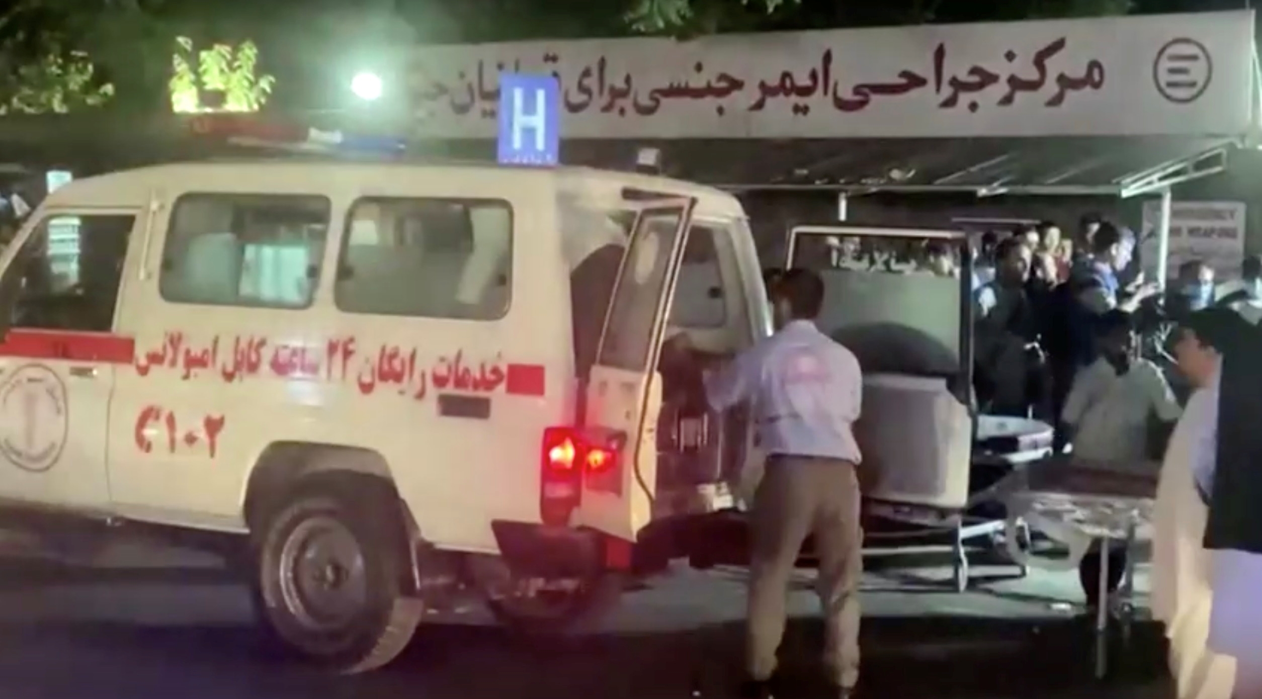 A screen grab shows an emergency vehicle as people arrive at a hospital after an attack at Kabul airport in Afghanistan on 26 August 2021.