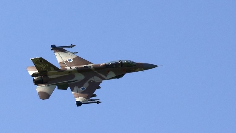 This picture taken from northern Israel shows an Israeli Air Force fighter jet flying over the border area with south Lebanon on 12 March 2024, amid ongoing cross-border tensions as Israel continues its onslaught on Gaza (AFP)