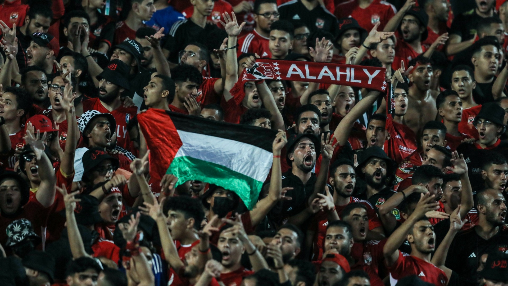 Fans of Al Al Ahly team raise the Palestinian flag during the African Football League semi-final match between Al-Ahly and Mamelodi Sundowns FC, at Cairo International Stadium, Egypt, 1 November 2023 (Ayman Aref/NurPhoto/via Reuters)