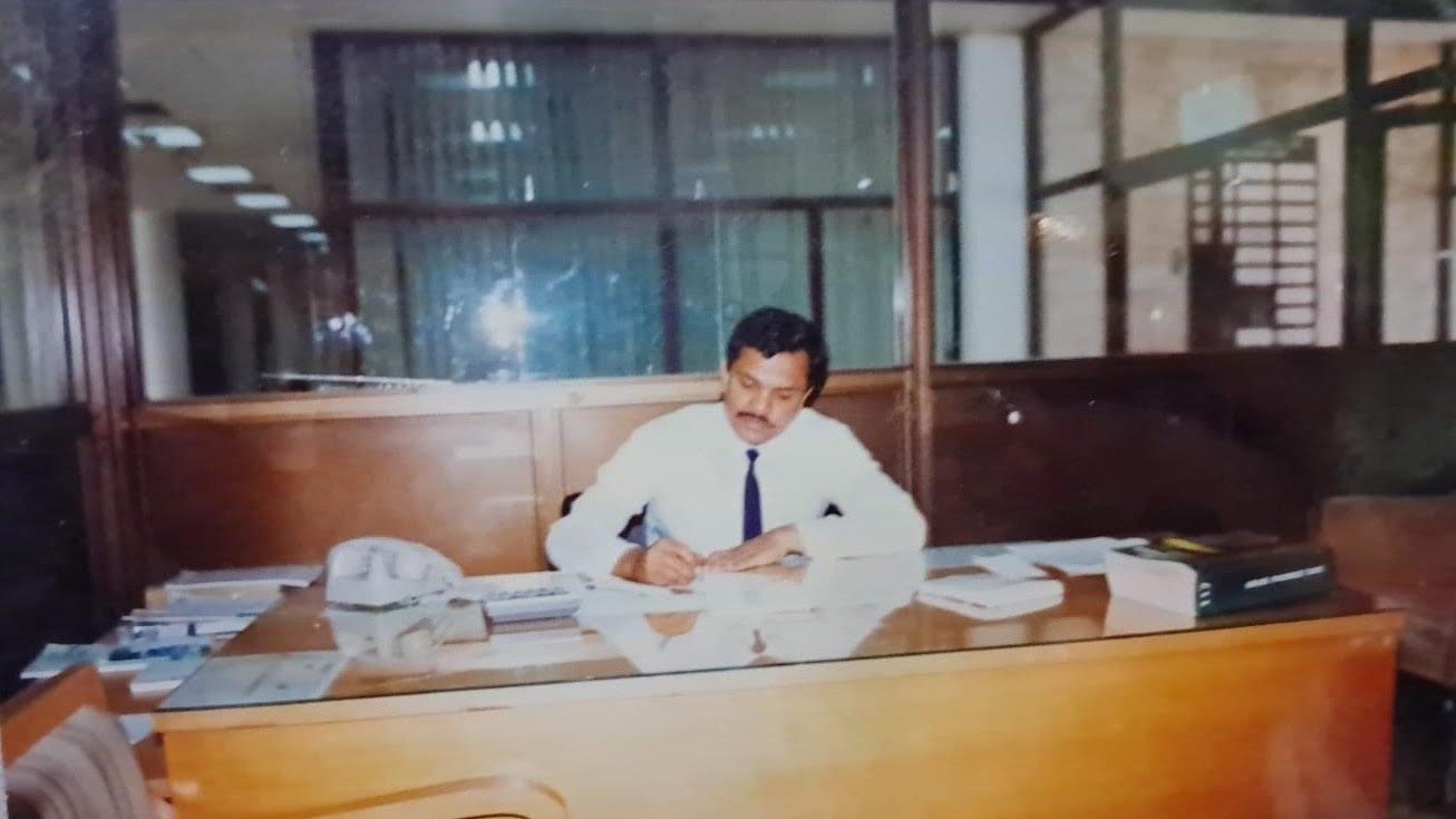 Ahmed Abdul Majeed working in the Al Tayyar Travel office in Riyadh in 1993 (Supplied)