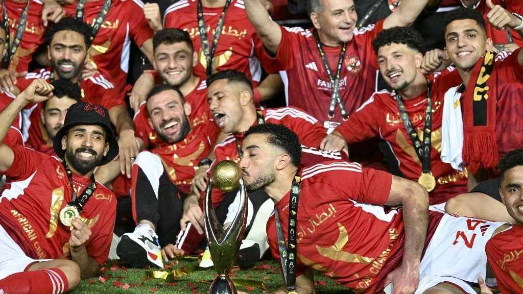 Ahly's players celebrate after winning the second leg of the African Champions League final against Esperance Sportive de Tunis at the Cairo International stadium on 25 May 2024 (Reuters)