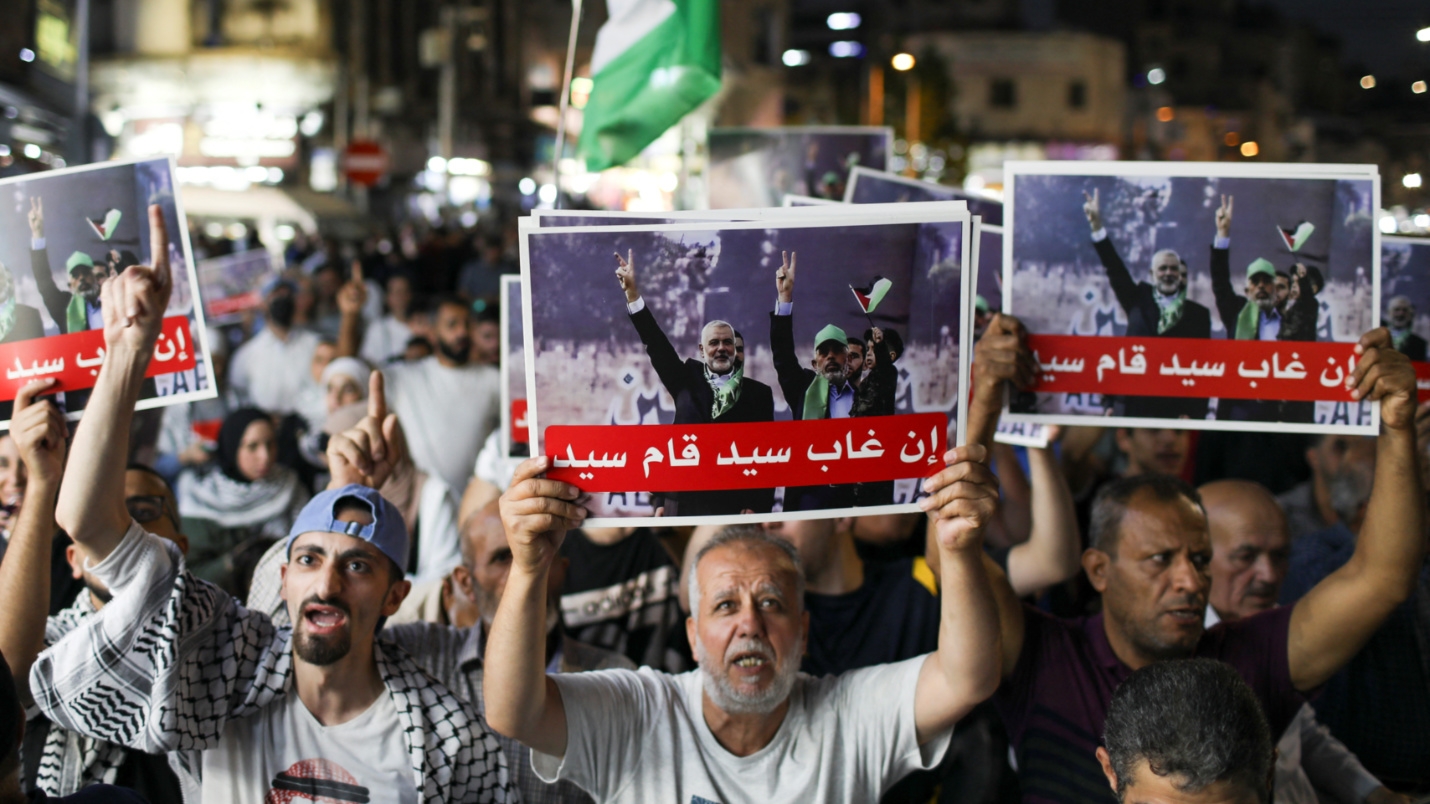 Protesters in Amman,  Jordan, carry placards honouring slain Palestinian figures on 9 August 2024 (Reuters/Alaa al-Sukhni)