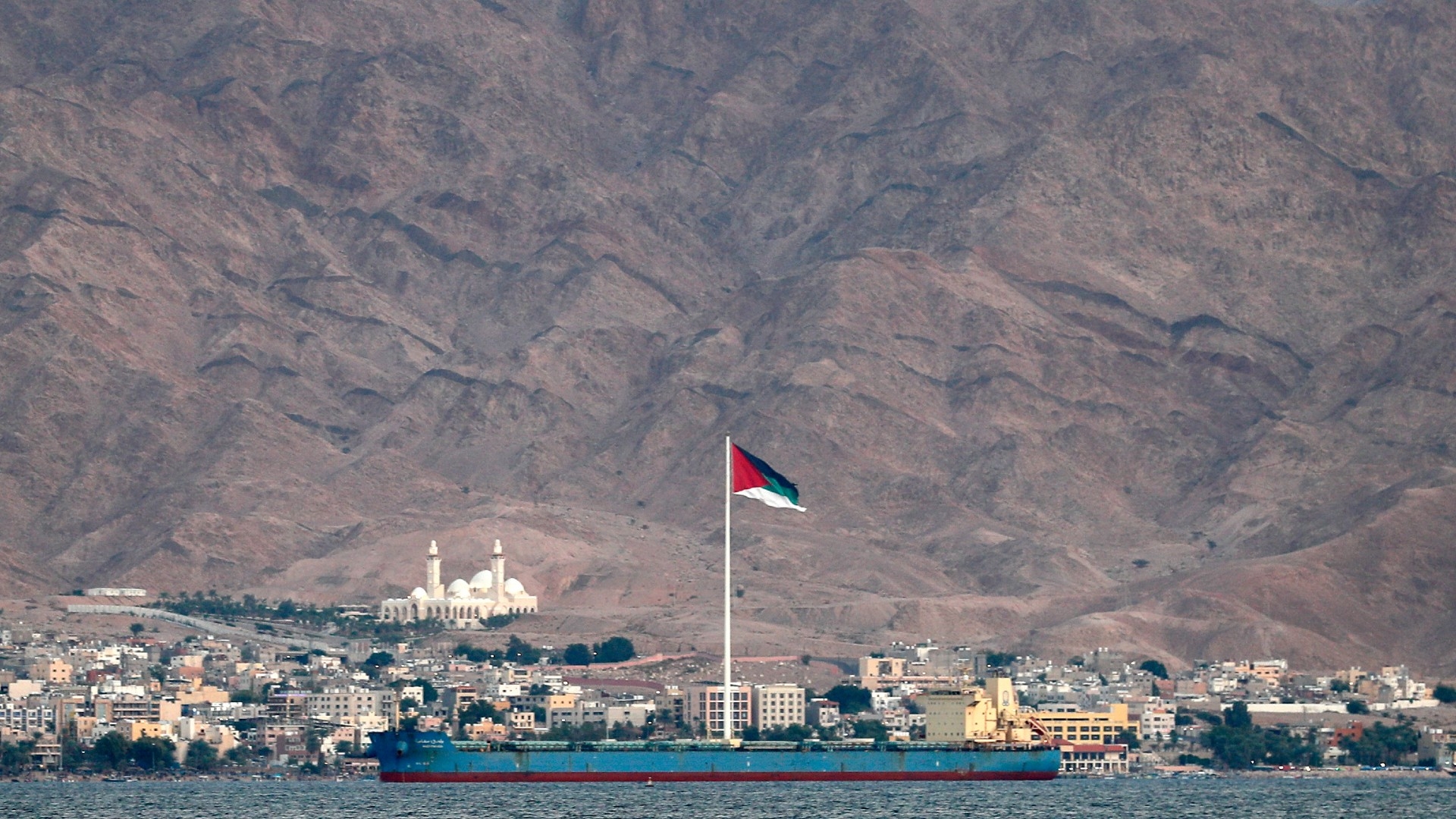 A view of the Flag of the Arab Revolt flying in Jordan's coastal city of Aqaba, where talks took place between Israeli and Palestinian officials (AFP/File photo)