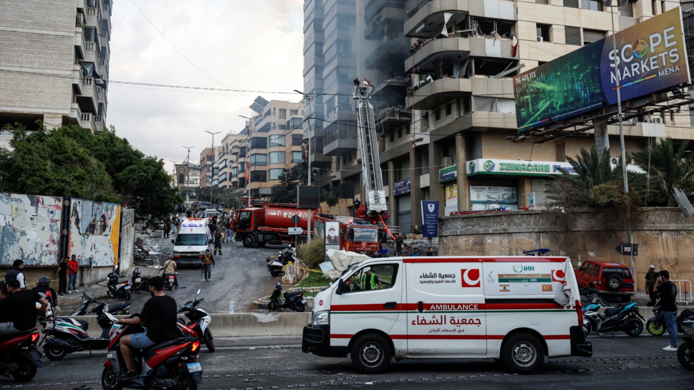 Rescuers work at a site of an Israeli strike on south Beirut on 1 October, 2024 (Louisa Gouliamaki/Reuters)