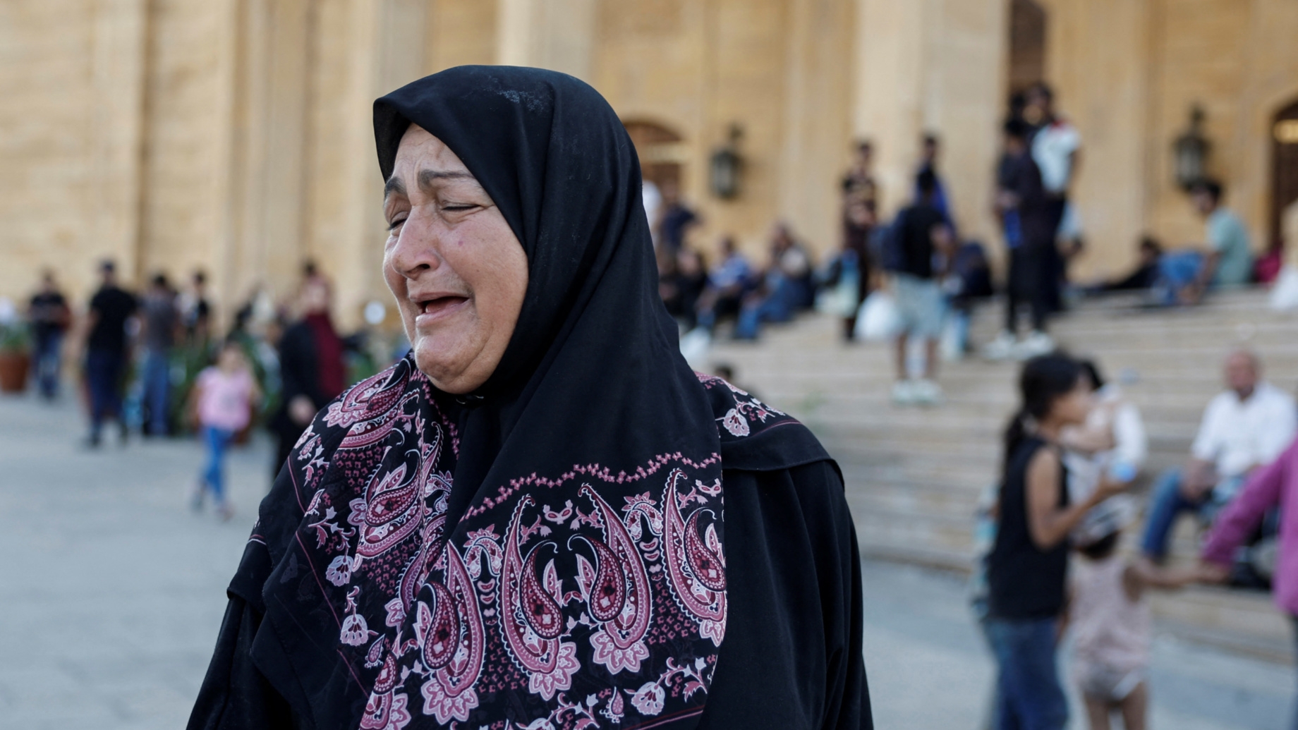 A woman reacts to the news of Hezbollah leader Sayed Hassan Nasrallah's killing in Beirut on 28 September 2024 (Louise Gouliamaki/Reuters)