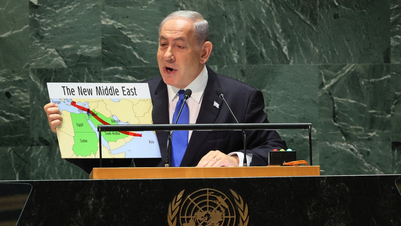 Israeli Prime Minister Benjamin Netanyahu holds up a map during his speech at the United Nations General Assembly (UNGA) on 22 September 2023 (AFP)