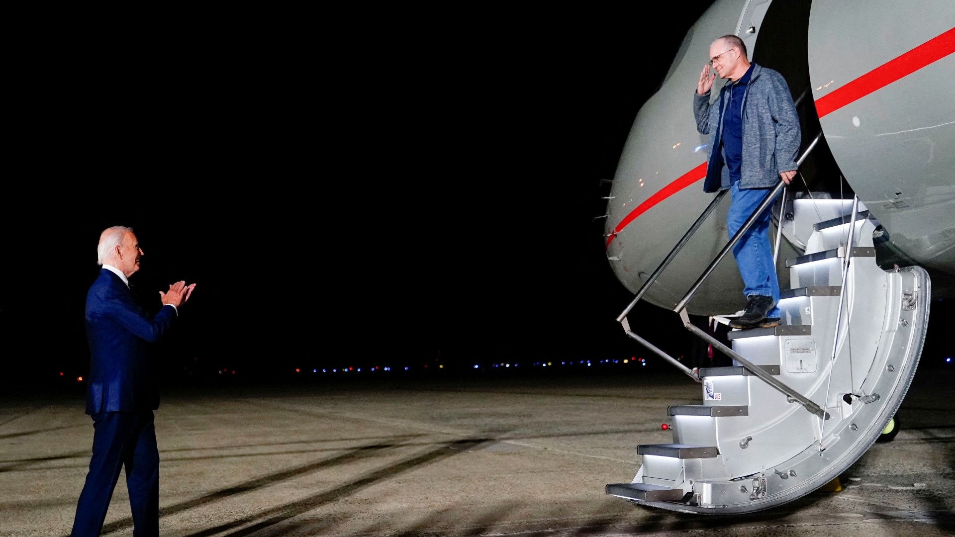 Joe Biden welcomes Paul Whelan upon his arrival at Joint Base Andrews in Maryland on 1 August, following his release from detention in Russia (Reuters/Nathan Howard)