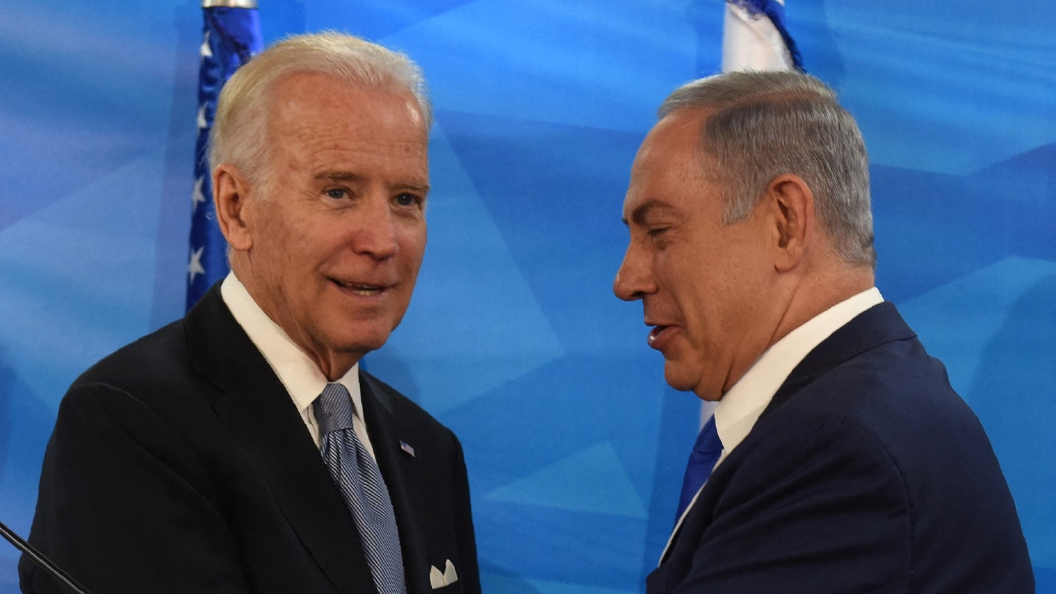 Then-US Vice President Joe Biden and Israeli Prime Minister Benjamin Netanyahu shake hands after giving joint statements in the prime minister's office in Jerusalem on 9 March 2016.