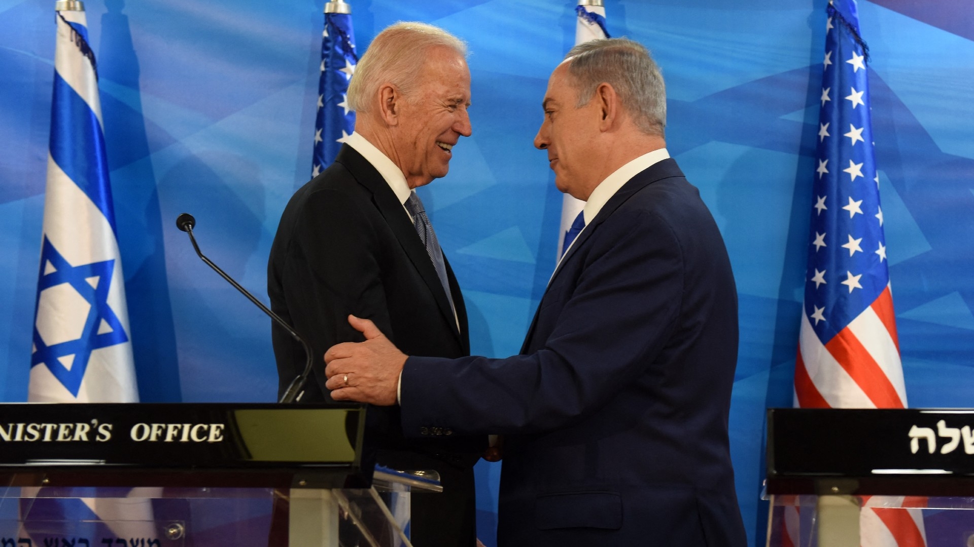 US Vice President Joe Biden and Israeli Prime Minister Benjamin Netanyahu shake hands in Jerusalem on 9 March 2016 (AFP)