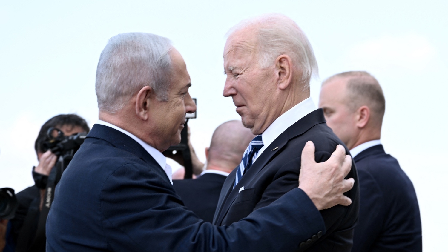 Israel Prime Minister Benjamin Netanyahu greets US President Joe Biden upon his arrival at Tel Aviv's Ben Gurion airport on 18 October 2023.