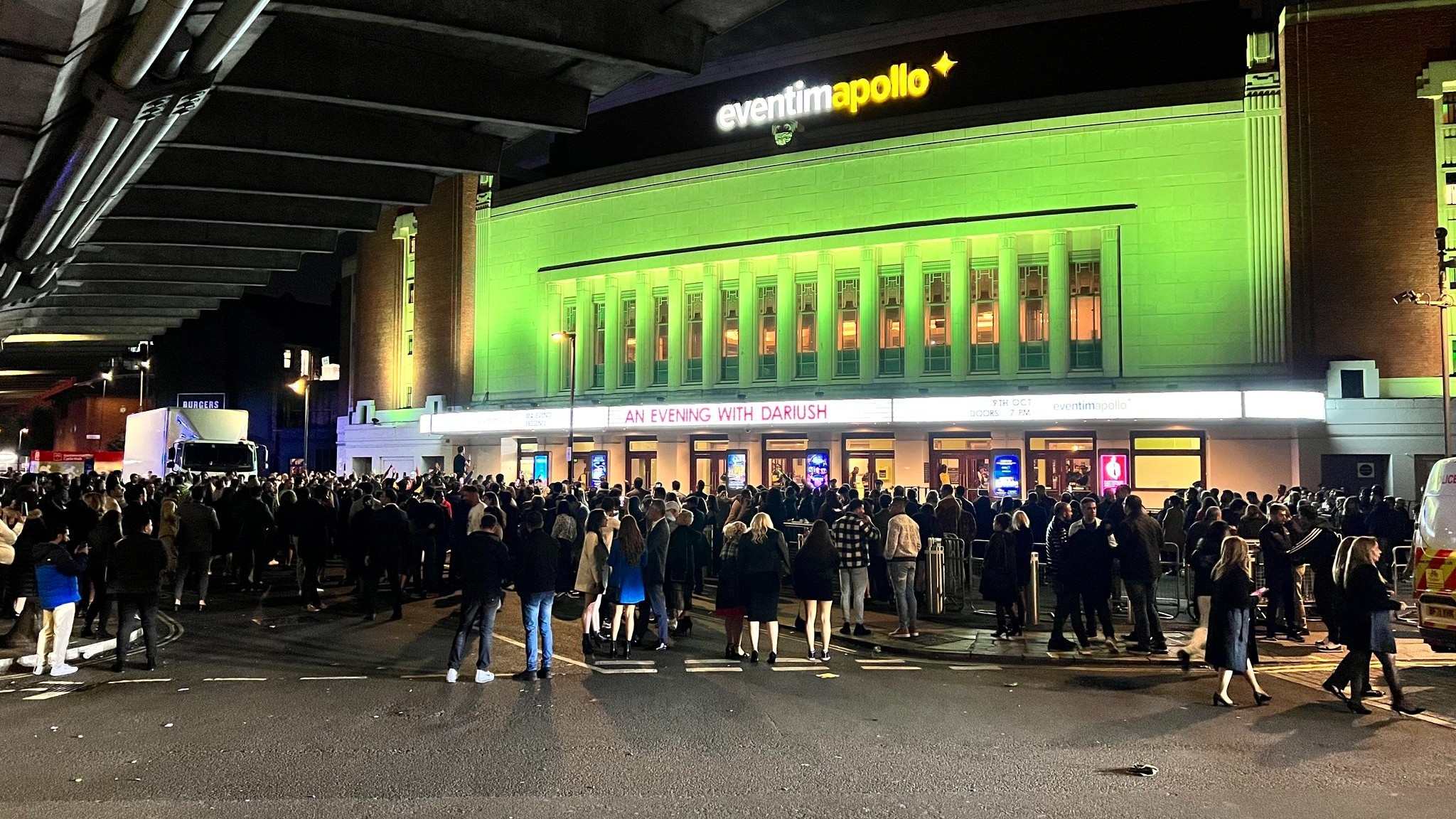 People gather outside the Eventim Apollo in Hammersmith, west London, after singer Dariush Eghbali's concert was evacuated on 9 October 2021 (Twitter/Mahdi Taghizadeh)