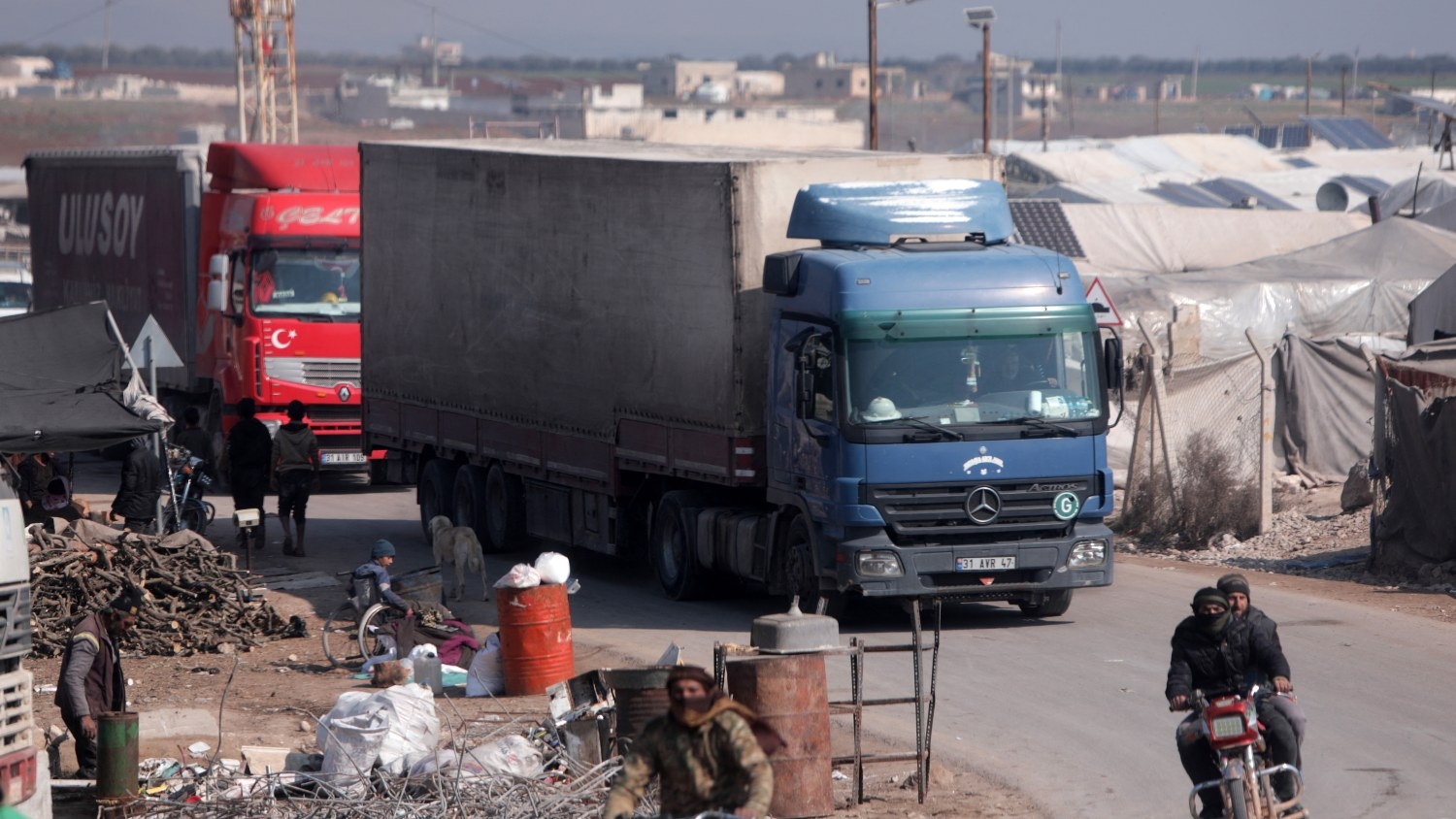 A convoy of trucks from Doctors Without Borders, carrying aid to earthquake victims, enters Syria via the al-Hamam border crossing on 19 February 2023.