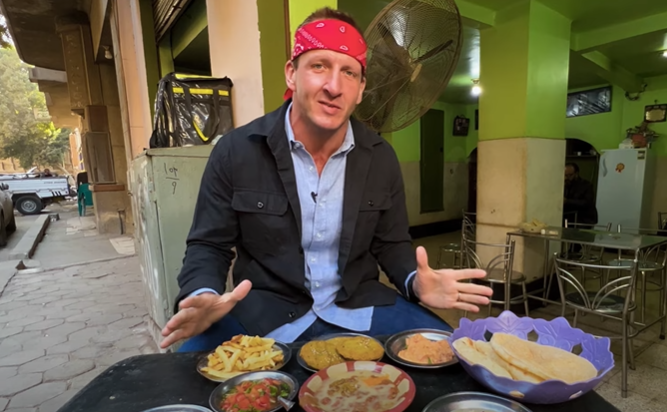 Will Sonbuchner, host of the 'Best Ever Food Review Show', filmed his series in Egypt on an iPhone after authorities confiscated filming equipment (Screengrab/Youtube)